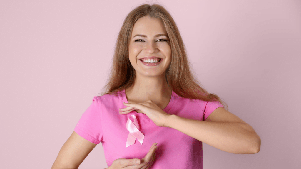 Ragazza con maglietta rosa a testimoniare la correlazione tra magnesio e prevenzione oncologica